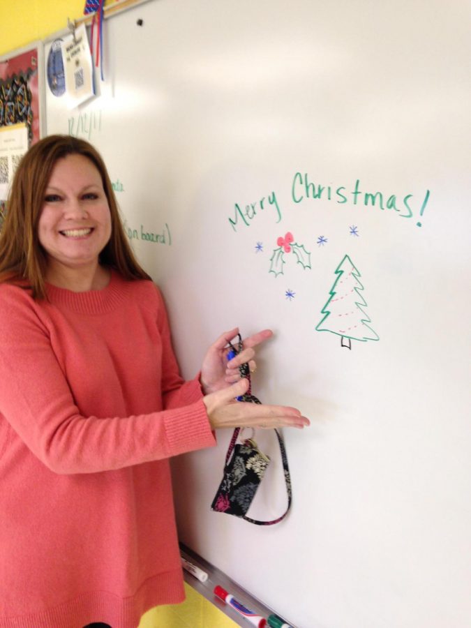 Mrs. Holt excitedly shows off her holiday masterpiece.