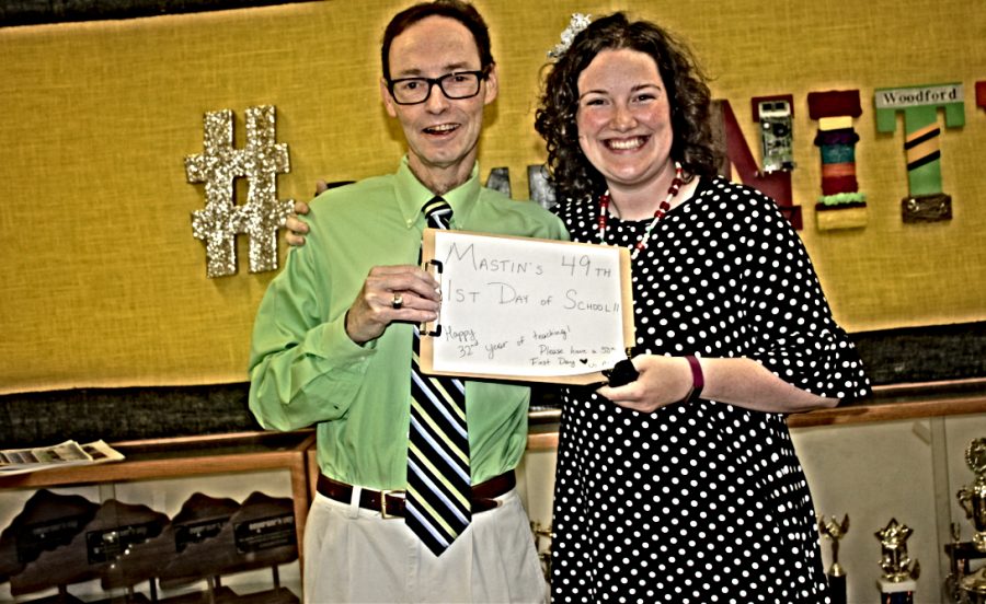 Mr. Mastin and Ms. York hold a sign that reads: Mastins 49th 1st day of school. 