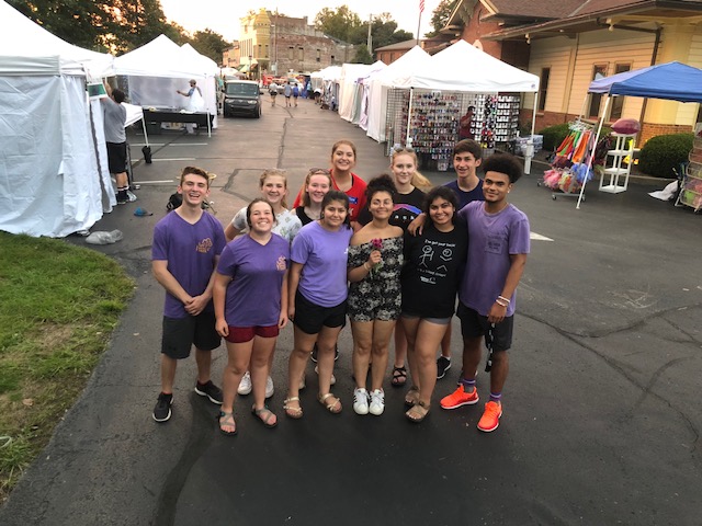 Community Activism enjoying their time helping set up the Midway Fall Festival.