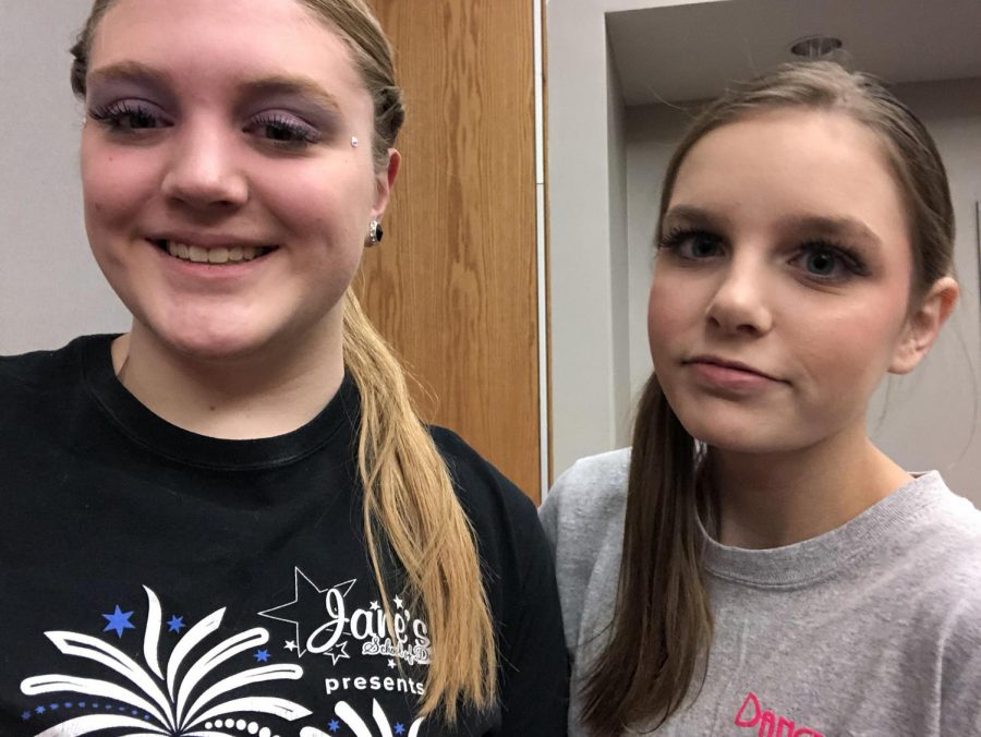 From left:  Kristen Bailey (9) and Abigail Johnson (10) getting makeup and hair done for their solos. Photo by Kristen Bailey.