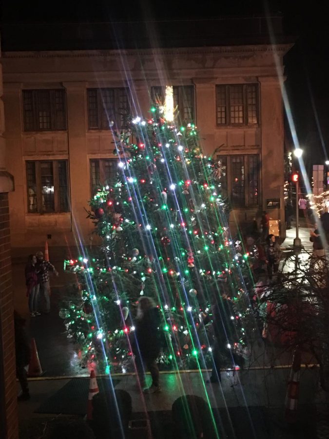 The community Christmas tree lights up Main Street downtown Versailles on Saturday, December 1, 2018.  