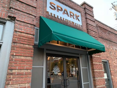 The Spark Community Cafes sign is lit up for opening night.
