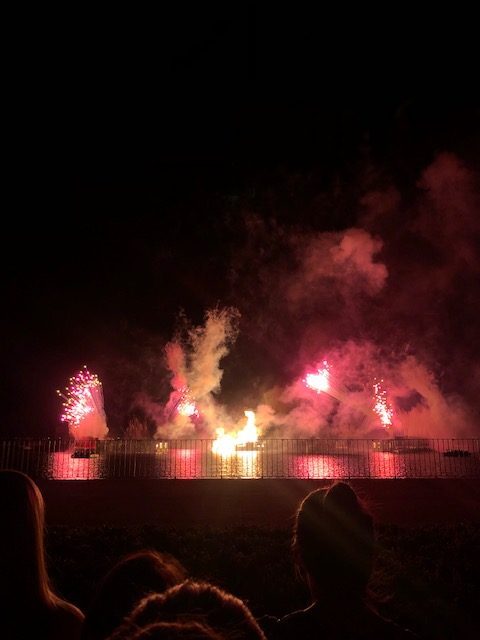 The fireworks show at Epcot flashes bright colors.