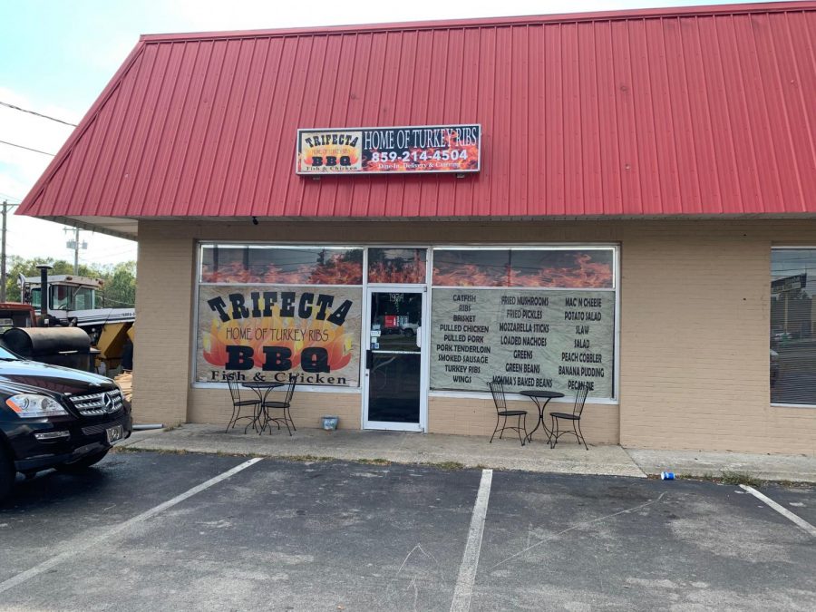 Trifecta Exterior. Decorated with advertisements and an outside grill.