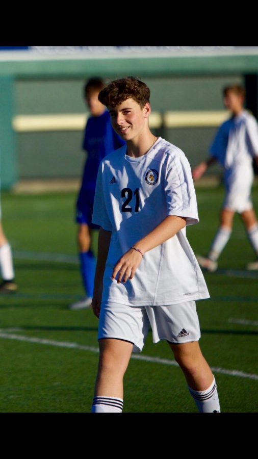 Nate Wells(10) warming up for his soccer game 