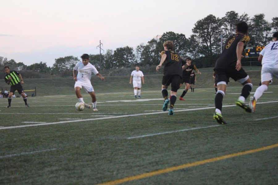 Seniors, Zack Ball #12 and Juan Velasco #9 fight together to win the ball back.