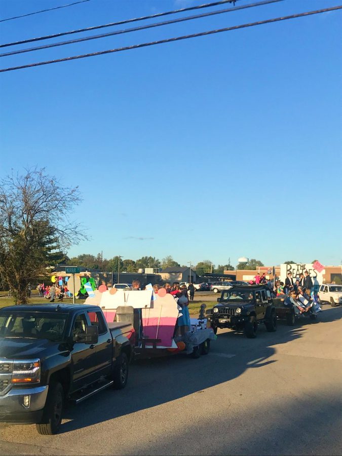 The floats prepare to head downtown from the high school.