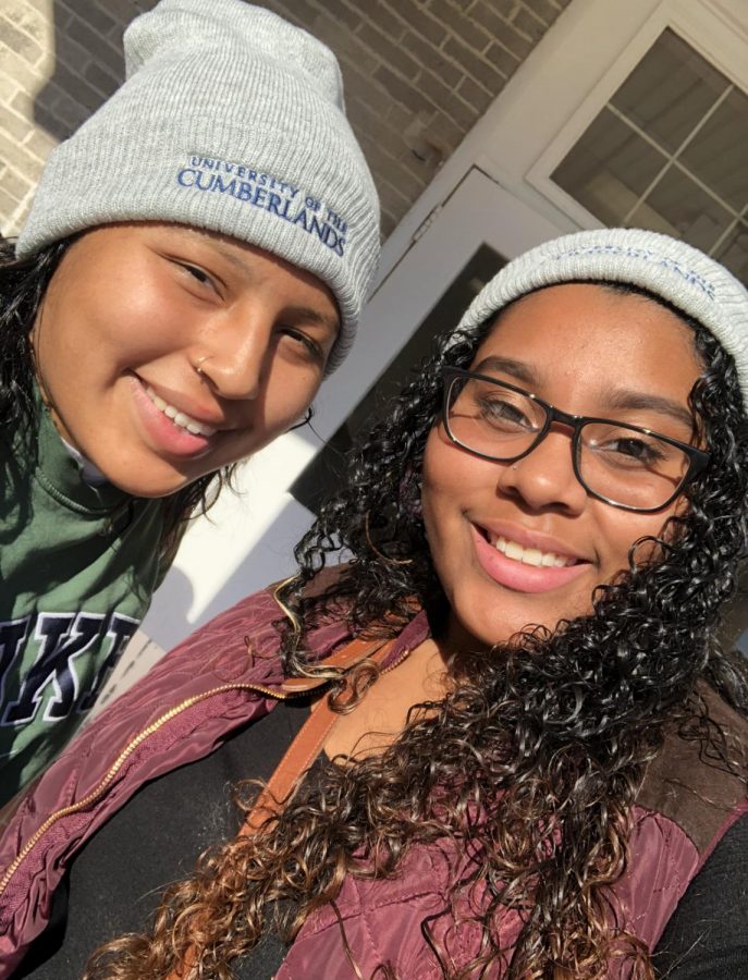 High school Senior (12) MaQuoia Bernabe and College Freshman Angela Buenrrostro taking a selfie.