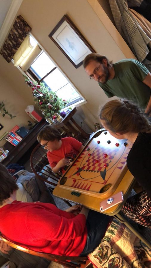 My family playing Carrom, an Indian game that is very popular in Europe.