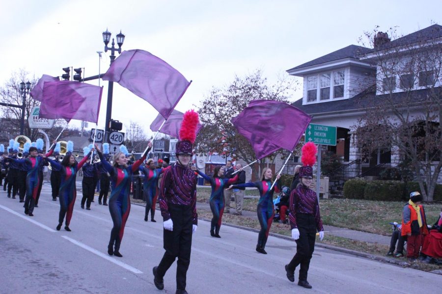 Members of the Woodford County High School Marching Band Ben Humphries (left) and Hunter Story (right) march in the parade.