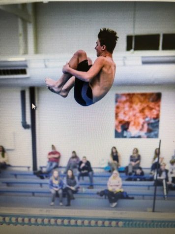 Logan Greene (10) in the midst of a dive competition.