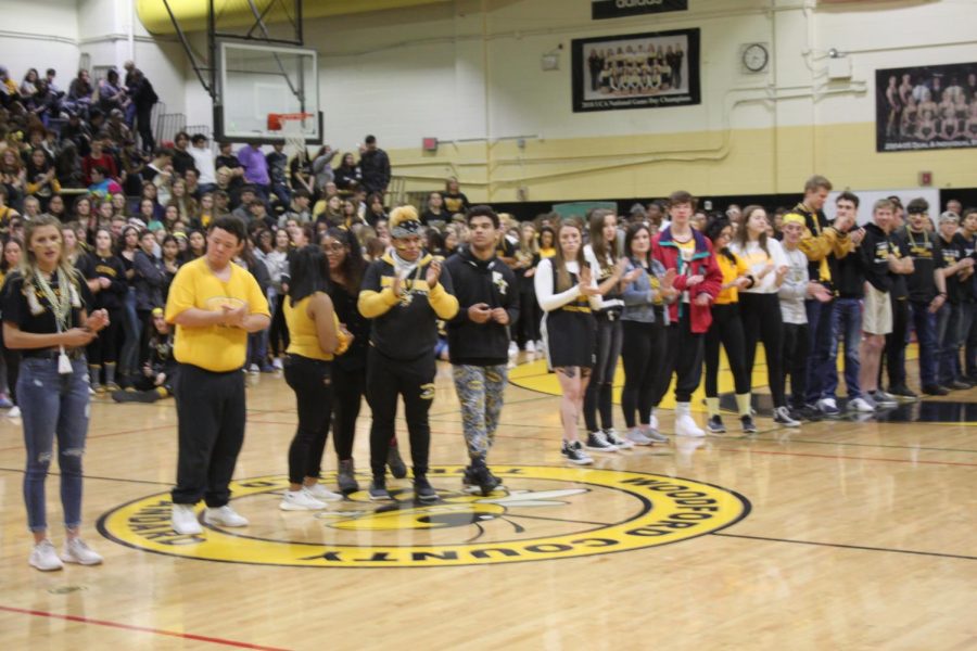 Senior+athletes+get+called+down+to+be+recognized+at+the+pep+rally.