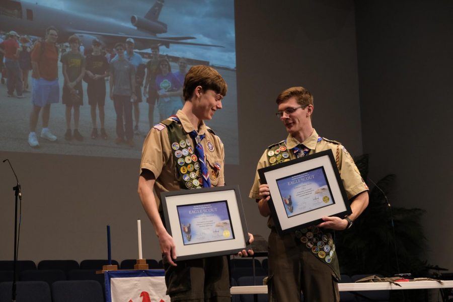 Landon Oxley and James Hawkins hold their certificates for earning Eagle Scout after their Court of Honor.