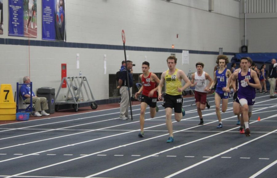 Colin Charles (12) leads his heat in the boys 1 mile race. Charles finished his race with a time of 5:14.6. This was Charles's first indoor track meet and he felt pretty good for his first race. "The indoor air is a lot different than outdoors; it hit me pretty hard," said Charles. "I'm hoping this'll be a good springboard for the rest of the outdoor season."