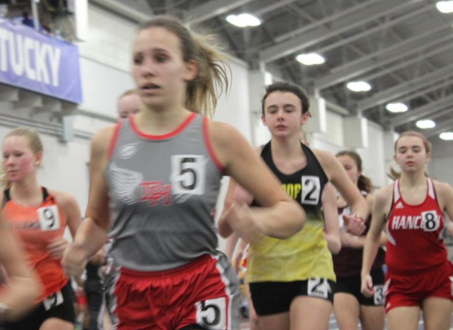 Maggie McSorley (10) races in the girls 800 meter run. McSorley finished with a time of 2:57.48. This was McSorleys first indoor track meet and she said she was very nervous as it was her first meet of the track season. I am excited to continue doing the 800, said McSorley. 