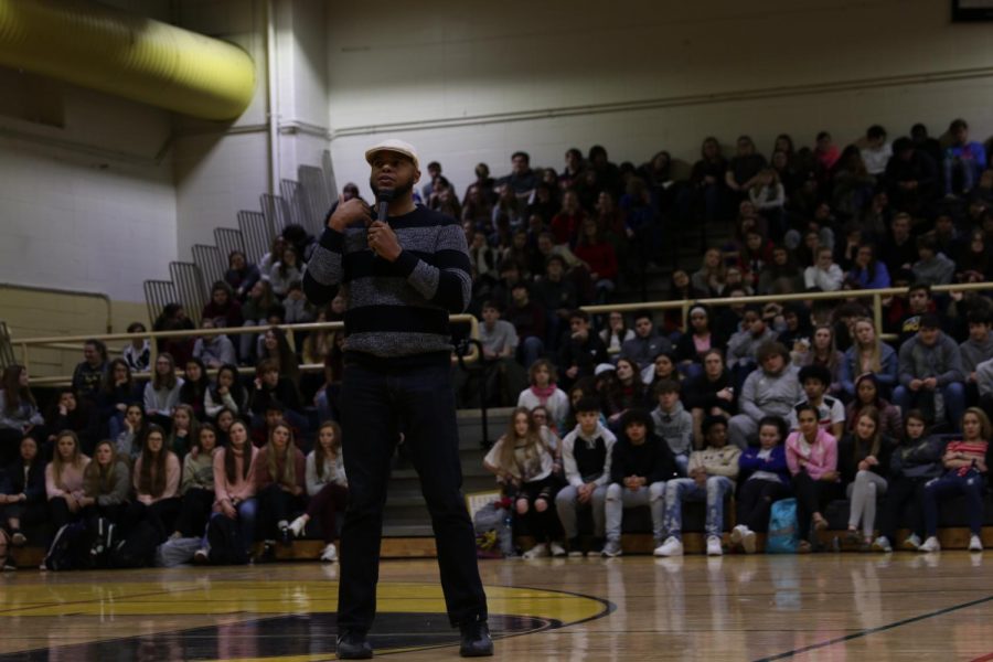 Devine Carama speaks to the entire student body at WCHS.