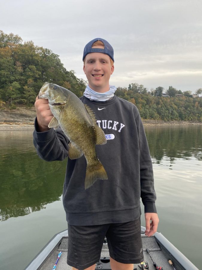 Mason Mefford holds up a smallmouth bass at Lake Cumberland, Kentucky. 