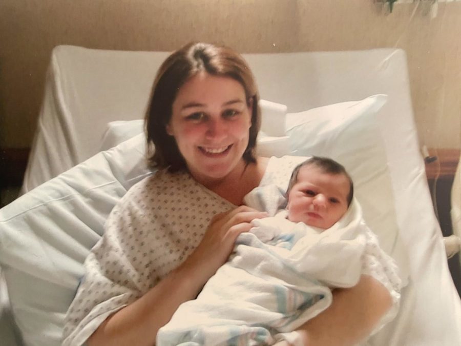 Becky lovingly holding newborn Anna 
