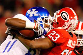 A Wildcat and Bulldog clash during the game on Saturday the 16th.