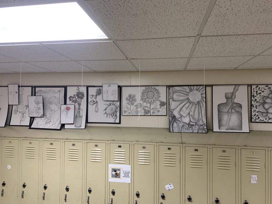Art Class Display is found at the bus circle exit nearest the culinary classrooms. These are a few of the Woodford County art students works. It is worth a detour through the area surrounding the art classroom every once in a while to see any new pieces that may be put on display.