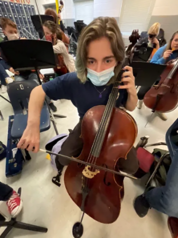 Conner Bybee participating in Orchestra class.