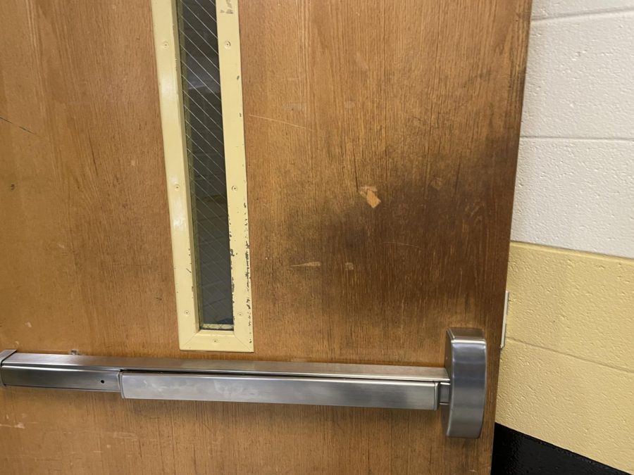 What a high quality door! The squeaking and stains from years of usage are indicative of how high-quality it is! Definitely should NOT be replaced any time soon!