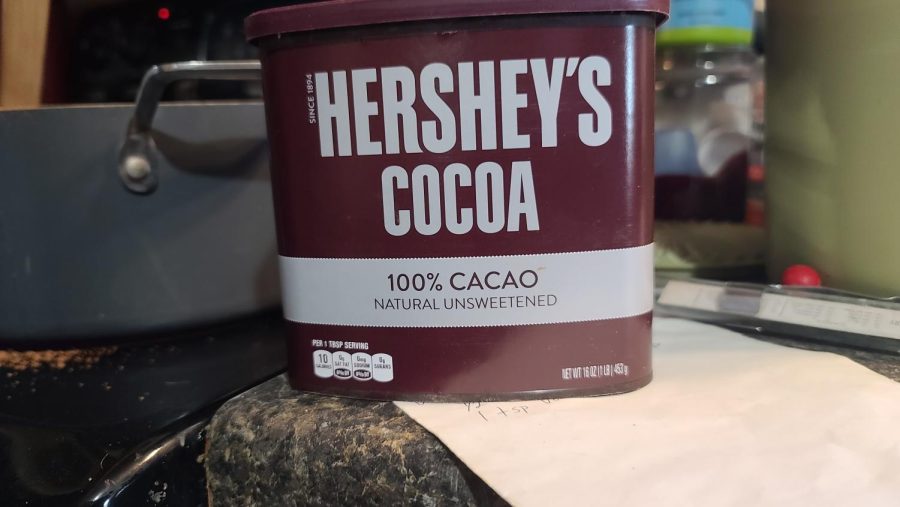 After the butter melts a bit, add in some good old Hersheys Cocoa. The standard recipe calls for 6 tablespoons. Since we quadrupled the recipe, 24 were needed.