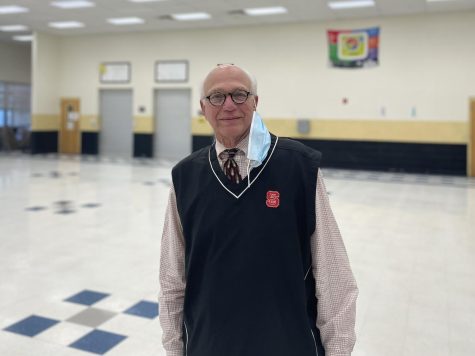 Dr. Bell, standing in the cafeteria, February 2022. 