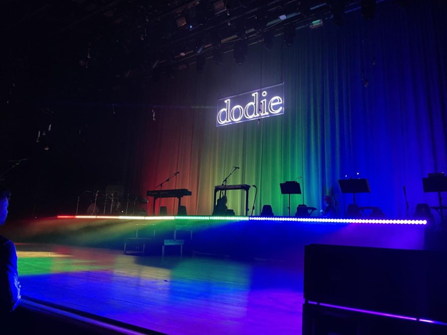 A+look+of+dodies+stage+set%2C+which+featured+a+neon+of+her+name%2C+dodie%2C+surrounded+by+a+pride+light+display.+