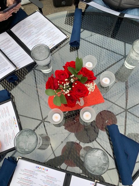 How  the table was set up when we got there.  It was set up with beautiful red roses and fake candles that lit up. 