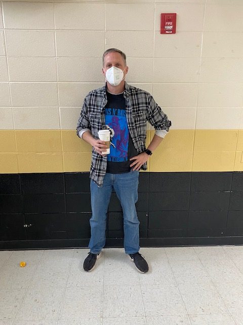 Mr. Faris is ready for Throwback Day with his Guns n Roses shirt and coffee. 
