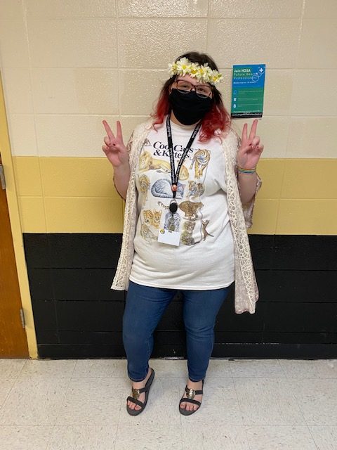 Ms. Dearinger gets groovy with her hippies themed outfit for Mondays Throwback Day!