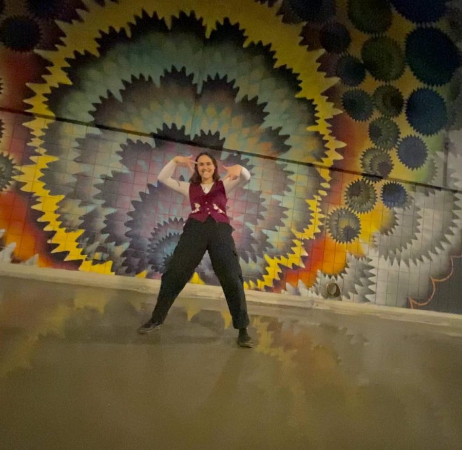 On the outside wall of Promo West Pavilion, there is a beautiful mural filled with unique designs and vibrant colors. I obviously had to take a picture in front of it. I wore a sweater vest with two dogs on it  because one of my favorite songs on Home Video is called Triple Dog Dare!! 