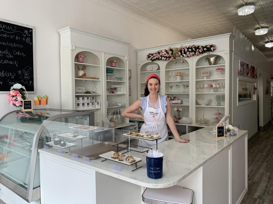 Kristen%2C+of+Kristens+Kreations%2C+stands+at+the+entrance+to+her+bakery.