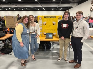 The Jacket Journal staff reporters present their State Level product at STLP. From left to right: Willa Michel (12), Max Savage (12), Brayden Miller (12), and Blake Heller (12).
