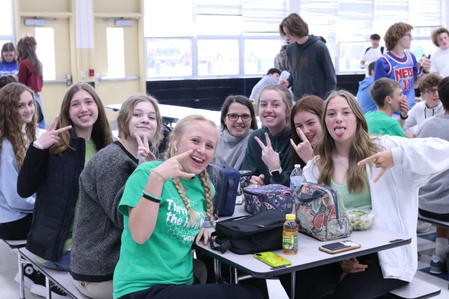 Freshmen throw up the peace sign while wearing their class color shirt during spirit week--they got it going on!
