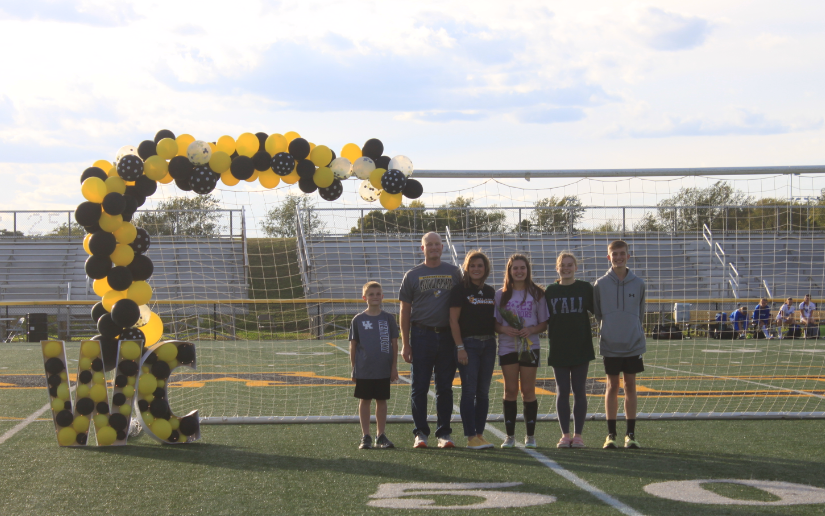 Deanna Burns, escorted by Sharyl and Michael Burns (Mom and Dad), Blake, Baileigh and Gavyn (siblings)