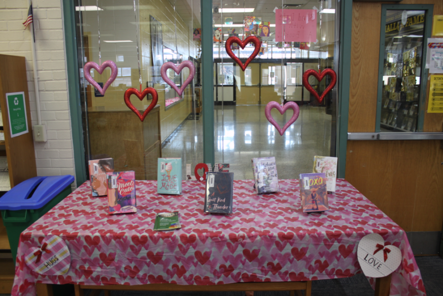 A variety of romance novels displayed in the library. 