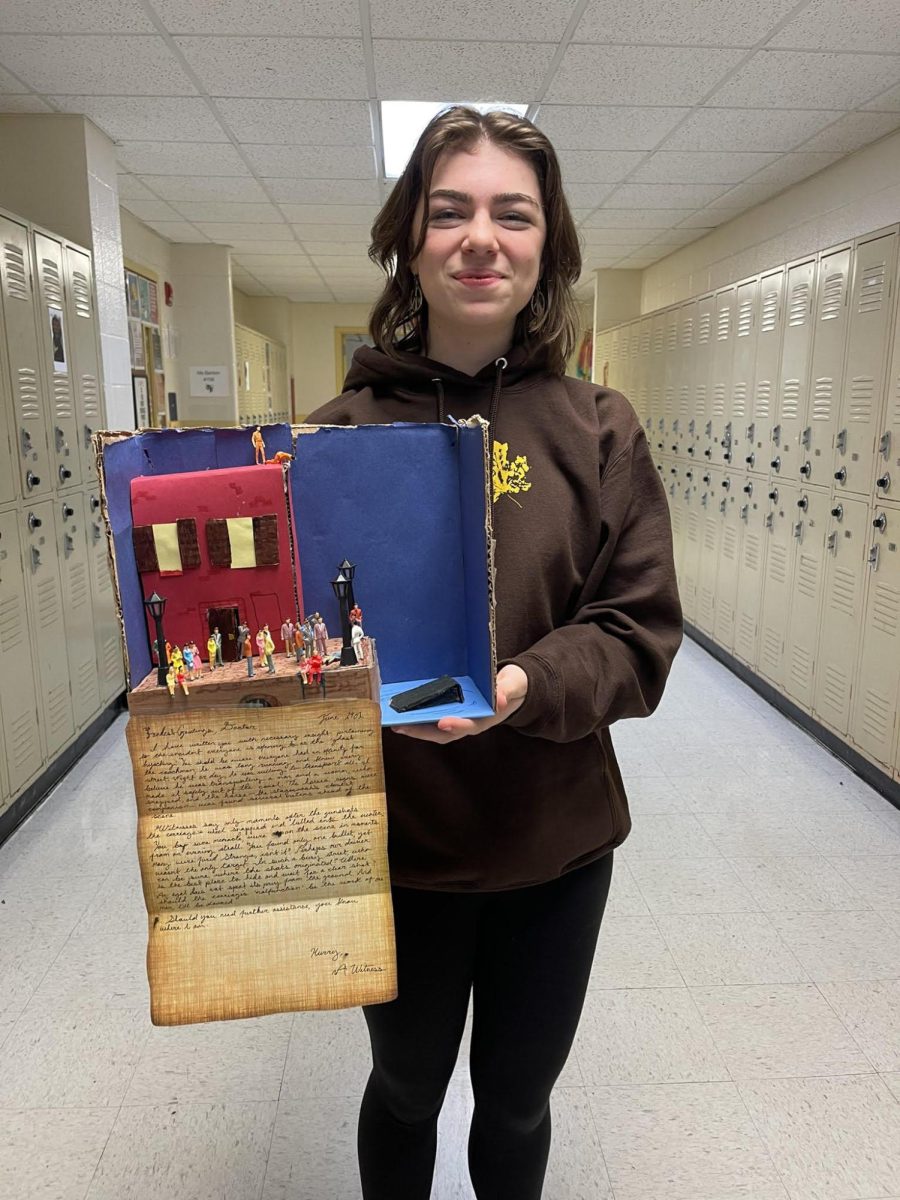 A student from last years class posing with her creation. 