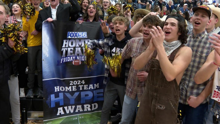 Students pose with FOX 56 award banner