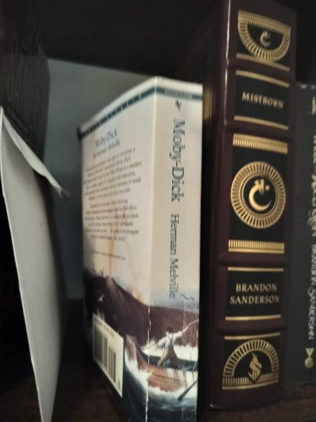 My copy of Moby-Dick along side my copy of Mistborn