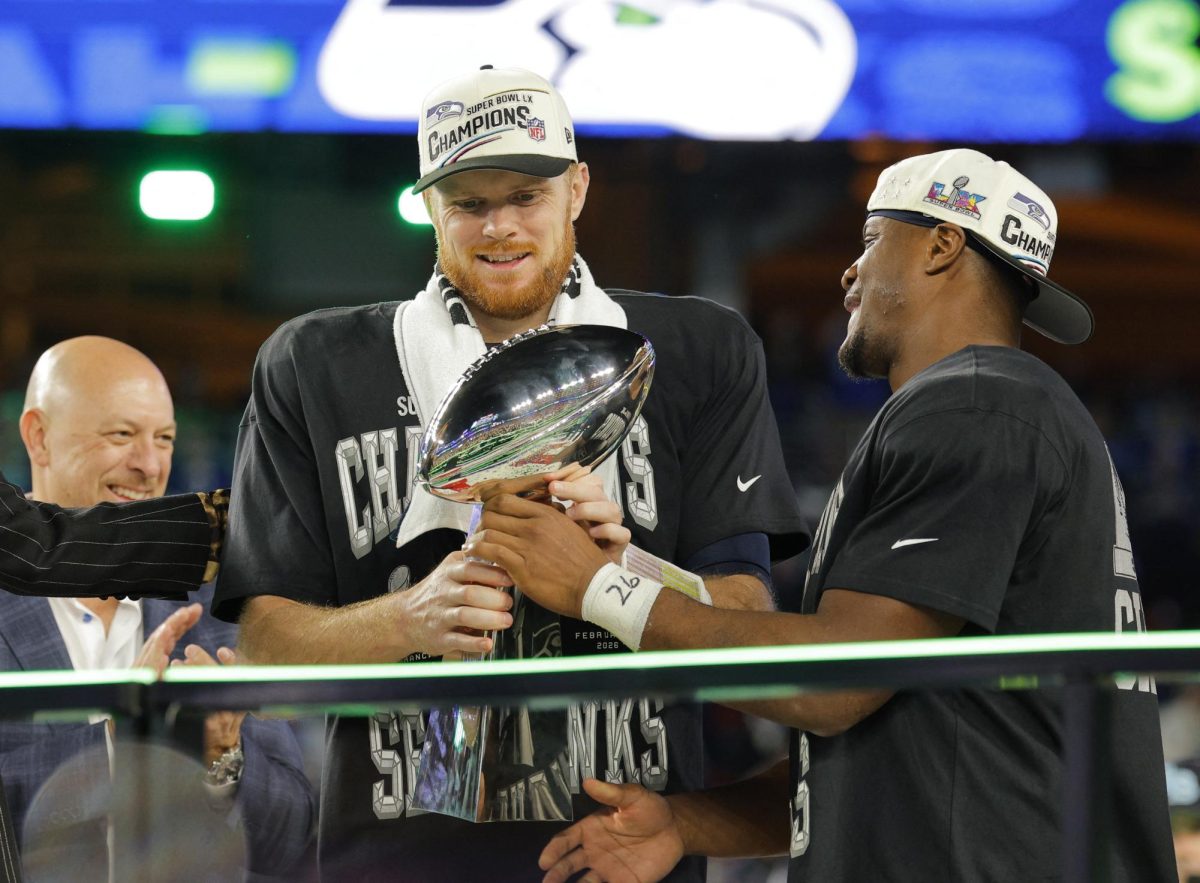 , 2026 Seattle Seahawks' Sam Darnold and Kenneth Walker III celebrate with the Vince Lombardi Trophy after winning Super Bowl LX REUTERS/Mike Blake