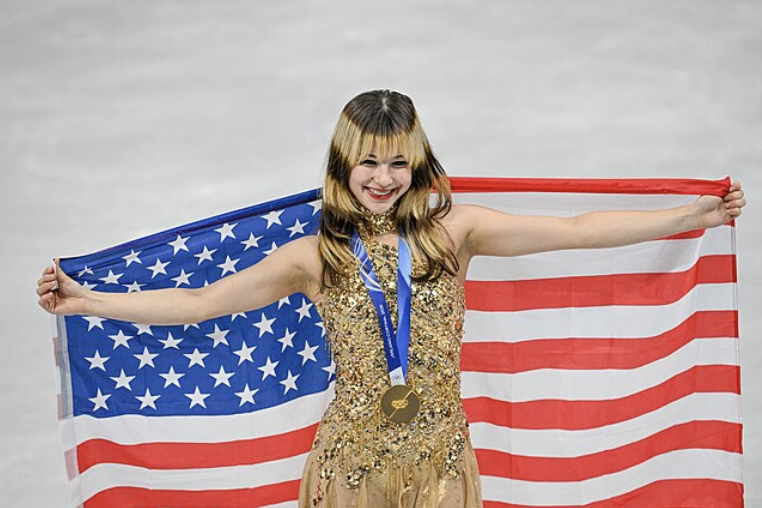 Alysa Liu (USA) with her gold medal after winning the women's figure skating singles