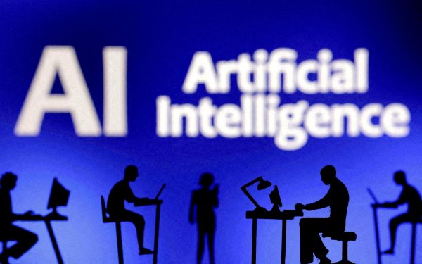 Figurines with computers and smartphones are seen in front of the words "Artificial Intelligence AI" in this illustration taken, February 19, 2024. REUTERS/Dado Ruvic/Illustration